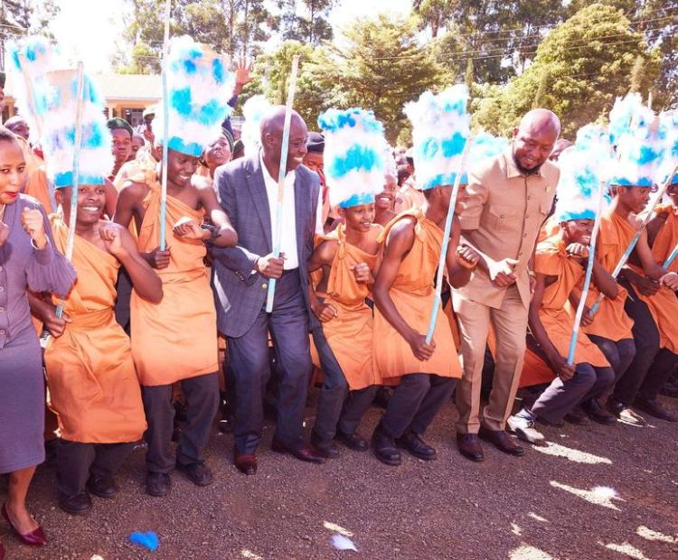 Deputy President Rigathi Gachagua joins Kianyaga Boys High School students in a Kikuyu traditional dance. He is an alumnus of the school. Photo: DPCS